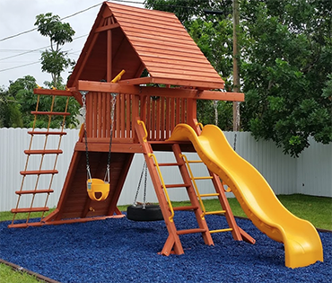 Play King Cooper City installation with blue rubber mulch