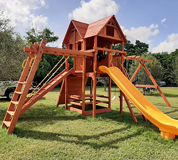 Here's a large angle base Woodplay playset Play King installed in Davie, Florida.