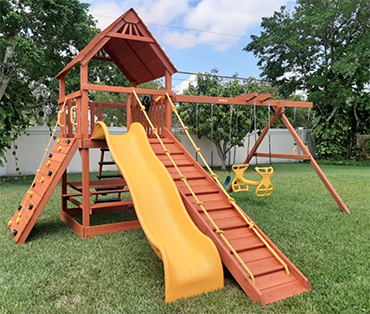 A Broward County Woodplay playset and swingset installation from Play King.